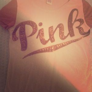 A victorysecret cream shirt with sparkles on sleve